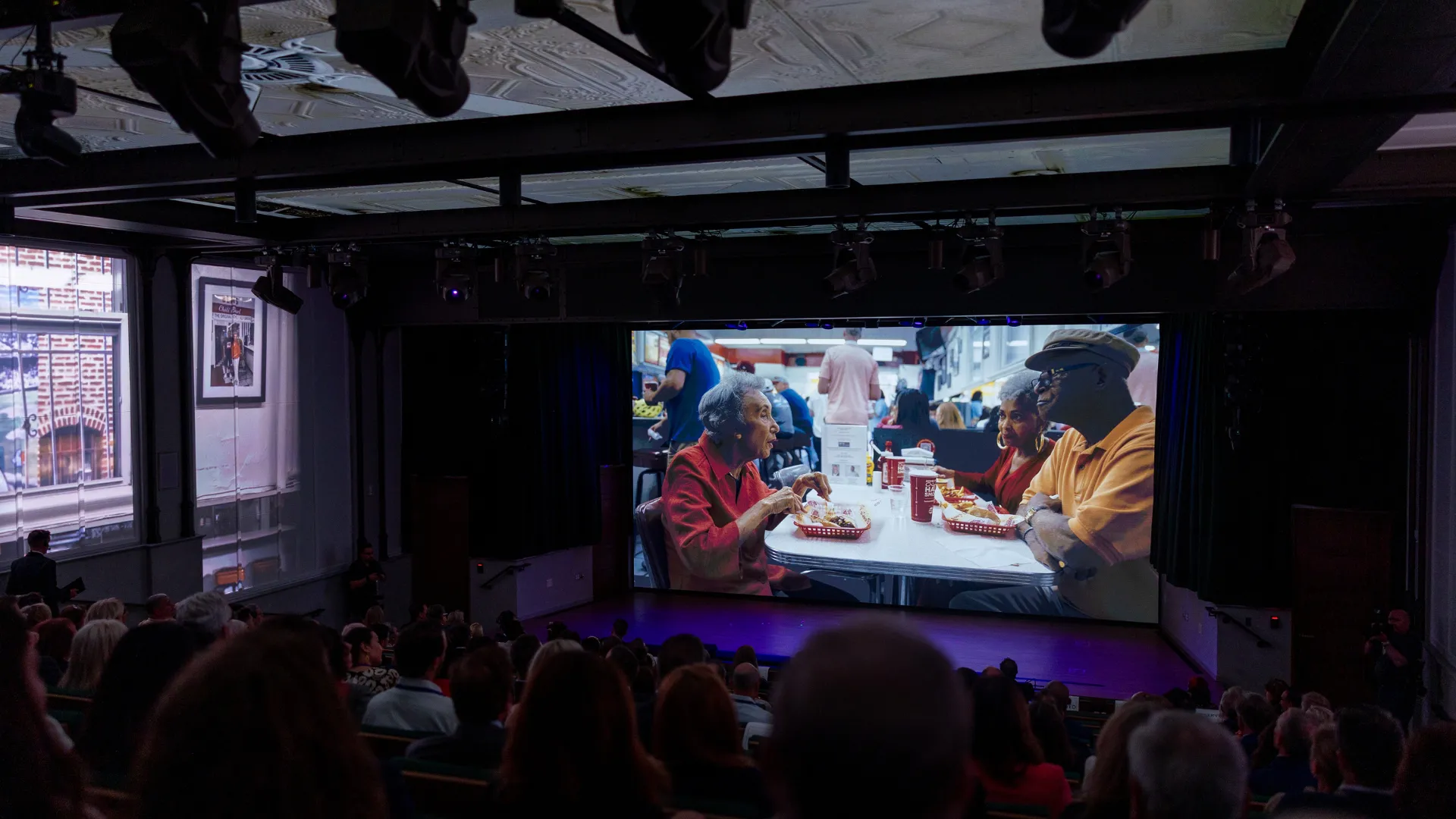 A photo from the film in the Stand Together Theatre. 