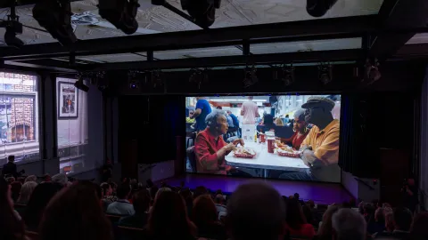 A photo from the film in the Stand Together Theatre. 