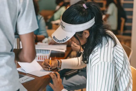 A visitor participates in a MCAAD workshop